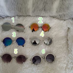 Sunglasses new with litters scratches no return no